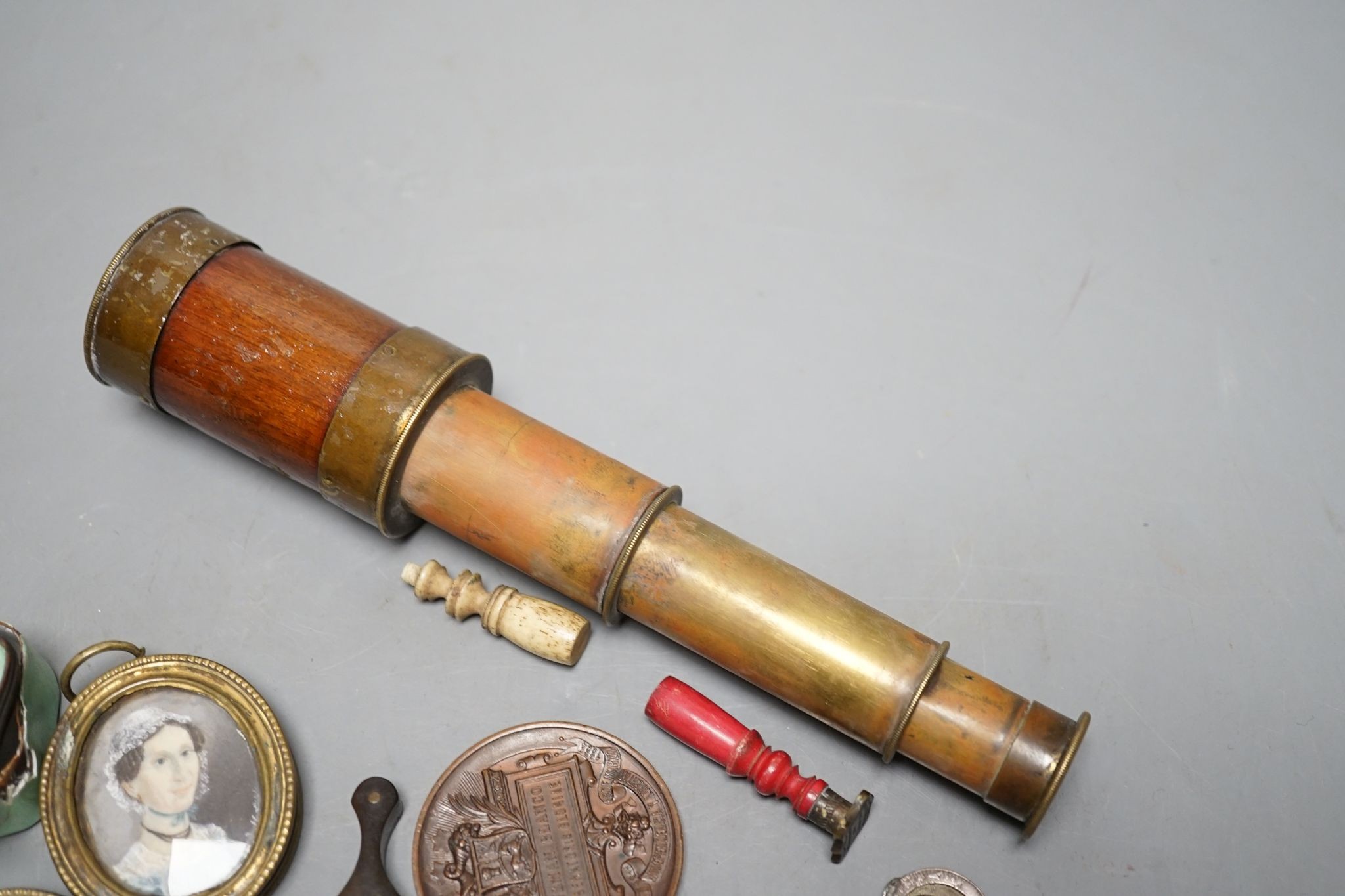A group of medals and objects of vertu, four-draw telescope,19 cms long, fully drawn.